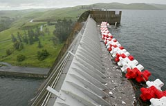 Water in Millerton Lake is about four feet from the top of the spillway at Friant Dam, which was expected to release 60,000 gallons per second Monday night into the San Joaquin River.